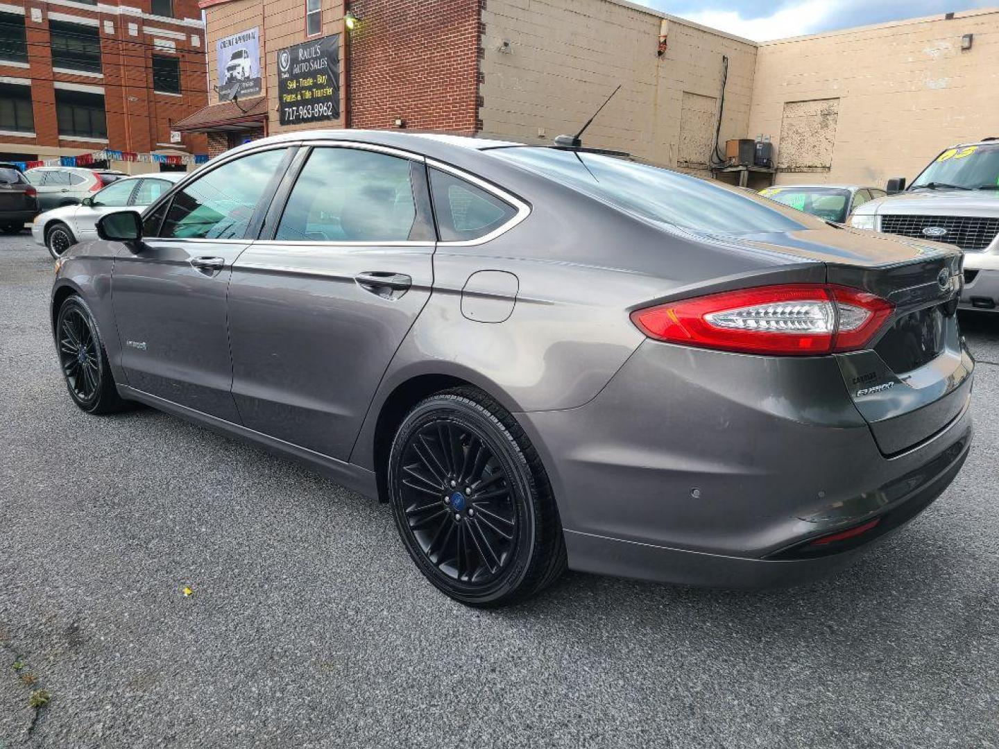 2013 GRAY FORD FUSION SE HYBRID (3FA6P0LU8DR) with an 2.0L engine, Continuously Variable transmission, located at 117 North Cameron Street, Harrisburg, PA, 17101, (717) 963-8962, 40.266762, -76.875259 - WE FINANCE!!! Good Credit/ Bad Credit/ No Credit - ALL Trade-Ins Welcomed!!! ***Guaranteed Credit Approval*** APPLY ONLINE or CALL us TODAY ;) Internet Prices and Marketplace Prices are SPECIAL discounted ***CASH DEALS*** Retail Prices are higher. Please call us to discuss your cash and finan - Photo#2