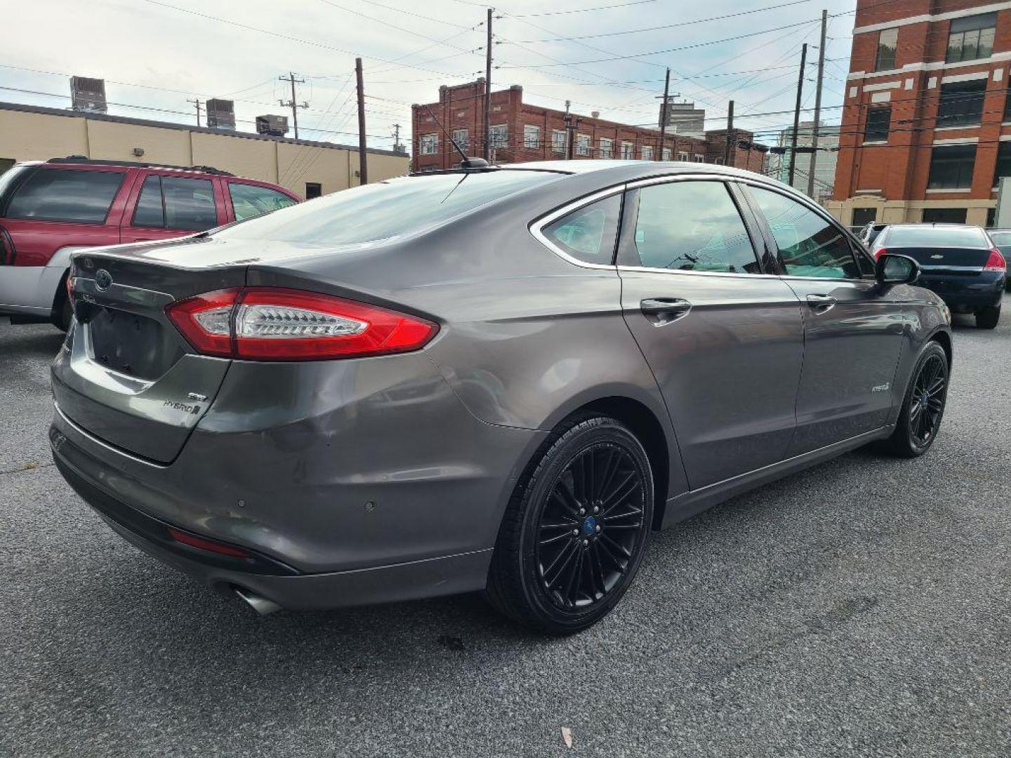 2013 GRAY FORD FUSION SE HYBRID (3FA6P0LU8DR) with an 2.0L engine, Continuously Variable transmission, located at 117 North Cameron Street, Harrisburg, PA, 17101, (717) 963-8962, 40.266762, -76.875259 - WE FINANCE!!! Good Credit/ Bad Credit/ No Credit - ALL Trade-Ins Welcomed!!! ***Guaranteed Credit Approval*** APPLY ONLINE or CALL us TODAY ;) Internet Prices and Marketplace Prices are SPECIAL discounted ***CASH DEALS*** Retail Prices are higher. Please call us to discuss your cash and finan - Photo#3