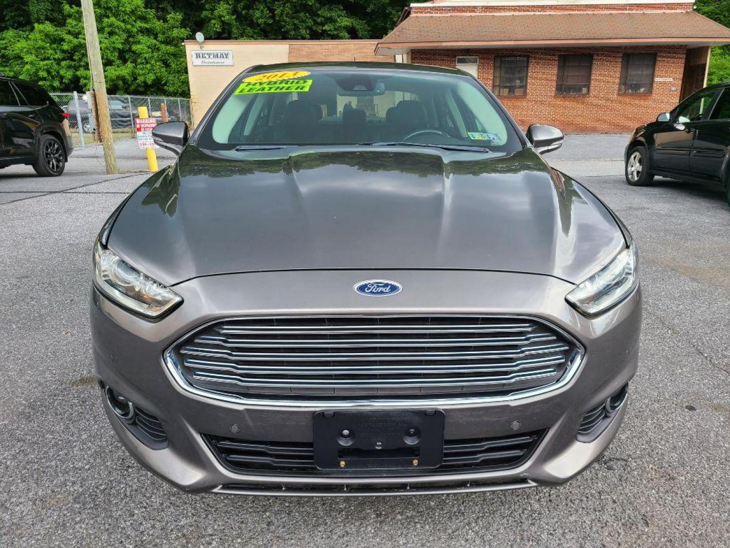 2013 GRAY FORD FUSION SE HYBRID (3FA6P0LU8DR) with an 2.0L engine, Continuously Variable transmission, located at 117 North Cameron Street, Harrisburg, PA, 17101, (717) 963-8962, 40.266762, -76.875259 - WE FINANCE!!! Good Credit/ Bad Credit/ No Credit - ALL Trade-Ins Welcomed!!! ***Guaranteed Credit Approval*** APPLY ONLINE or CALL us TODAY ;) Internet Prices and Marketplace Prices are SPECIAL discounted ***CASH DEALS*** Retail Prices are higher. Please call us to discuss your cash and finan - Photo#7