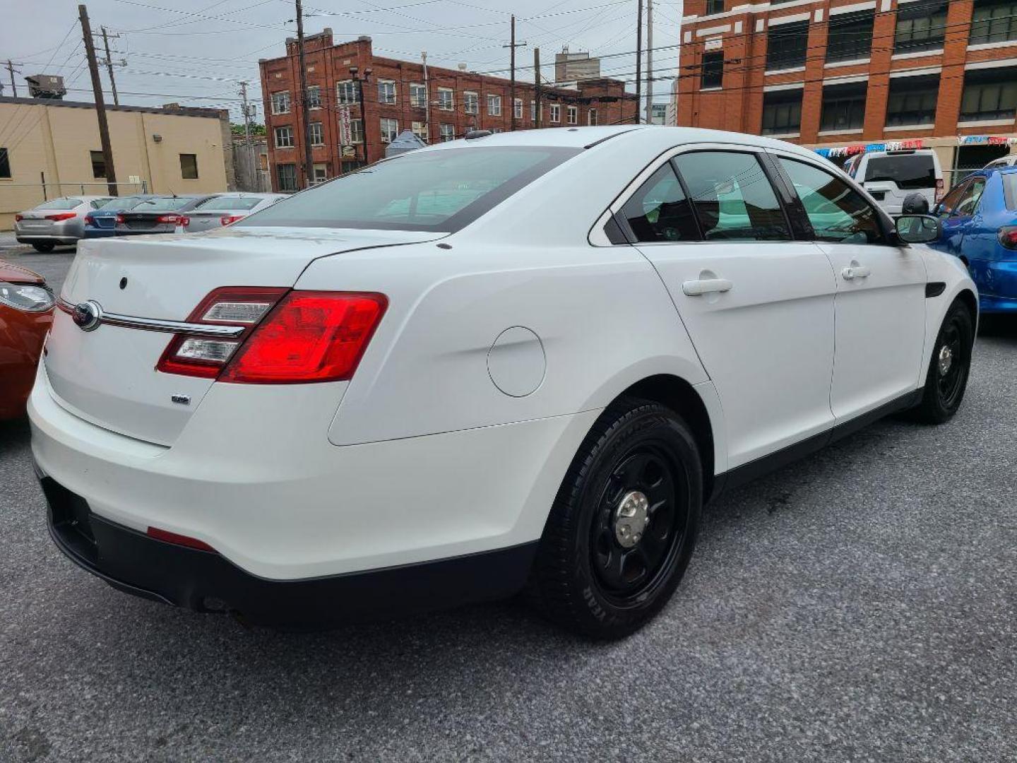 2013 WHITE FORD TAURUS POLICE INTERCEPTOR (1FAHP2MK8DG) with an 3.7L engine, Automatic transmission, located at 117 North Cameron Street, Harrisburg, PA, 17101, (717) 963-8962, 40.266762, -76.875259 - WE FINANCE!!! Good Credit/ Bad Credit/ No Credit - ALL Trade-Ins Welcomed!!! ***Guaranteed Credit Approval*** APPLY ONLINE or CALL us TODAY ;) Internet Prices and Marketplace Prices are SPECIAL discounted ***CASH DEALS*** Retail Prices are higher. Please call us to discuss your cash and finan - Photo#4