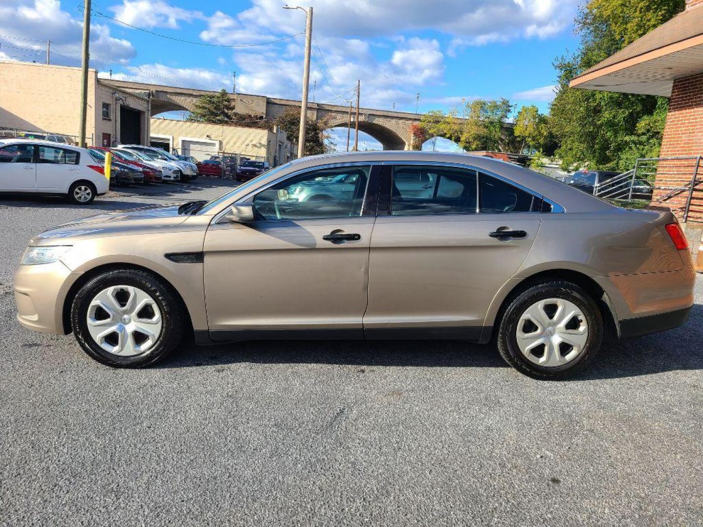 2013 TAN FORD TAURUS POLICE INTERCEPTOR (1FAHP2M82DG) with an 3.5L engine, Automatic transmission, located at 117 North Cameron Street, Harrisburg, PA, 17101, (717) 963-8962, 40.266762, -76.875259 - WE FINANCE!!! Good Credit/ Bad Credit/ No Credit - ALL Trade-Ins Welcomed!!! ***Guaranteed Credit Approval*** APPLY ONLINE or CALL us TODAY ;) Please call us to discuss your cash and financing options. - Photo#1