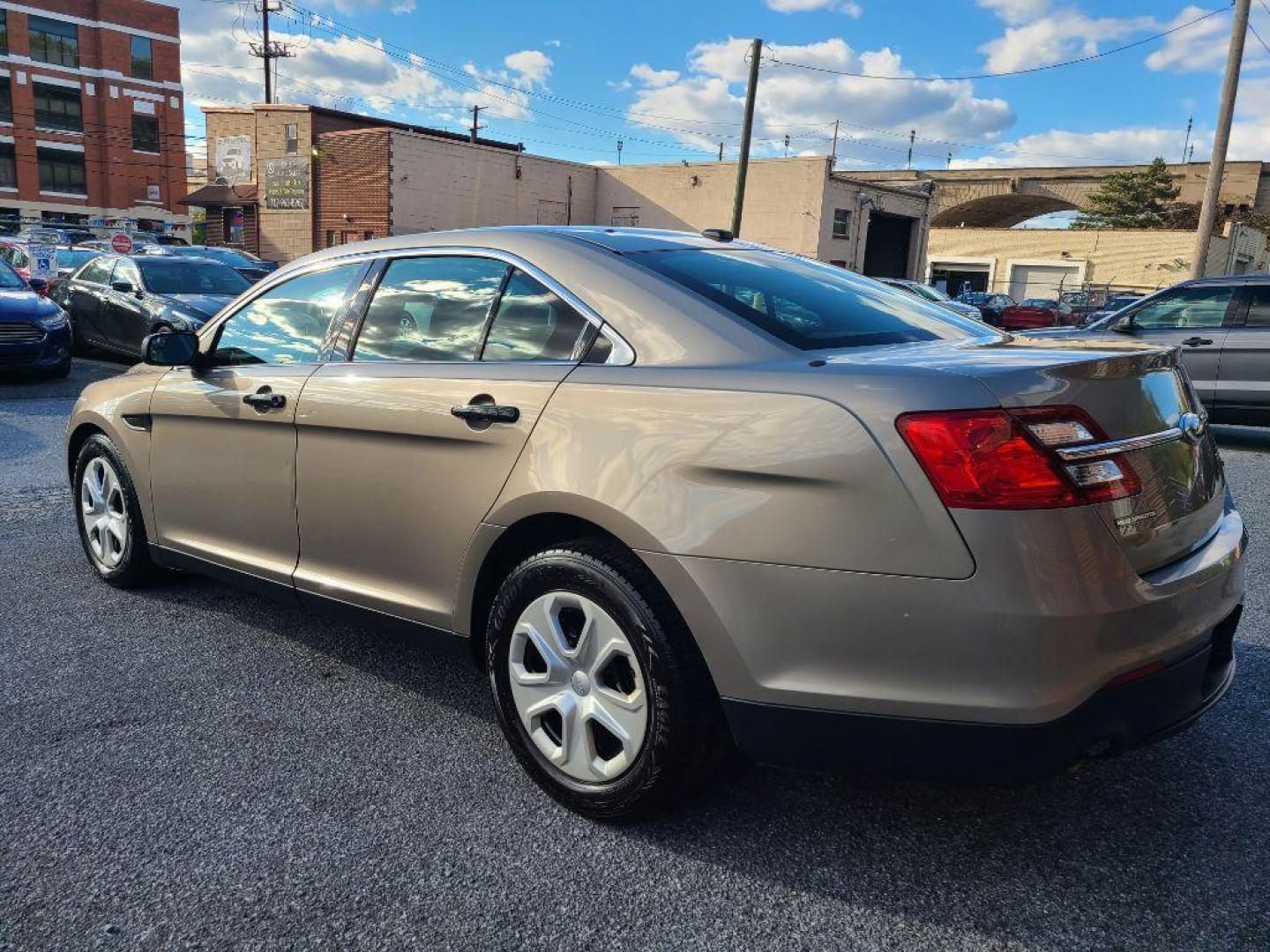 2013 TAN FORD TAURUS POLICE INTERCEPTOR (1FAHP2M82DG) with an 3.5L engine, Automatic transmission, located at 117 North Cameron Street, Harrisburg, PA, 17101, (717) 963-8962, 40.266762, -76.875259 - WE FINANCE!!! Good Credit/ Bad Credit/ No Credit - ALL Trade-Ins Welcomed!!! ***Guaranteed Credit Approval*** APPLY ONLINE or CALL us TODAY ;) Please call us to discuss your cash and financing options. - Photo#2