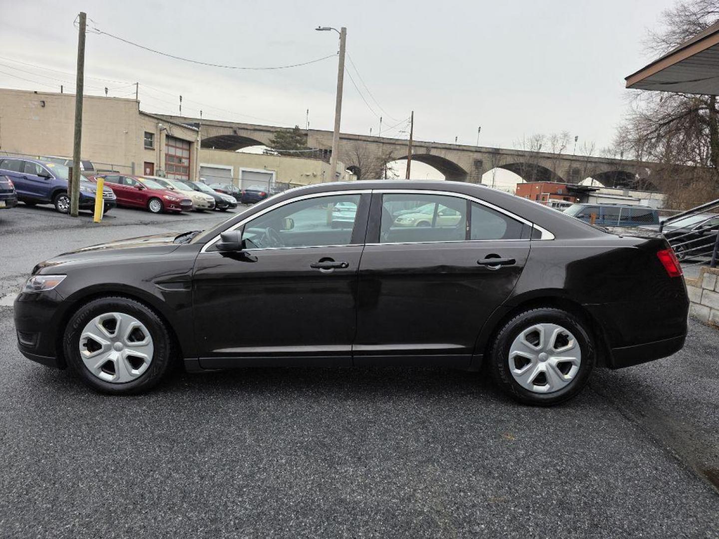 2013 BROWN FORD TAURUS POLICE INTERCEPTOR (1FAHP2MKXDG) with an 3.7L engine, Automatic transmission, located at 117 North Cameron Street, Harrisburg, PA, 17101, (717) 963-8962, 40.266762, -76.875259 - WE FINANCE!!! Good Credit/ Challenged Credit/ No Credit - ALL Trade-Ins Welcomed!!! APPLY ONLINE or CALL us TODAY ;) Please call us to discuss your cash and/or financing options. - Photo#1