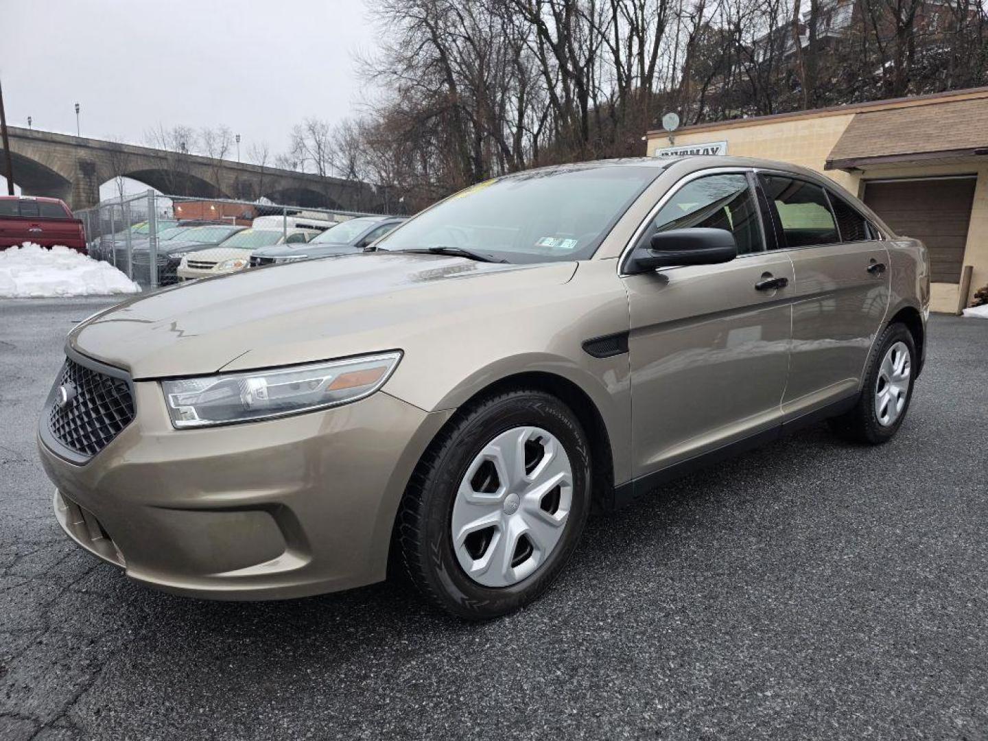 2013 GOLD FORD TAURUS POLICE INTERCEPTOR (1FAHP2M87DG) with an 3.5L engine, Automatic transmission, located at 117 North Cameron Street, Harrisburg, PA, 17101, (717) 963-8962, 40.266762, -76.875259 - WE FINANCE!!! Good Credit/ Challenged Credit/ No Credit - ALL Trade-Ins Welcomed!!! APPLY ONLINE or CALL us TODAY ;) Please call us to discuss your cash and/or financing options. - Photo#0