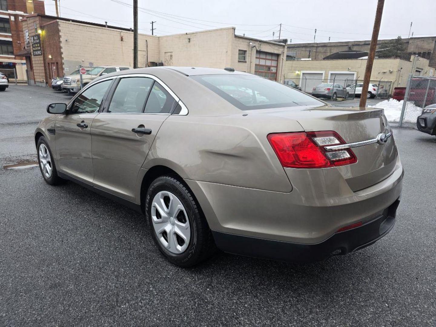 2013 GOLD FORD TAURUS POLICE INTERCEPTOR (1FAHP2M87DG) with an 3.5L engine, Automatic transmission, located at 117 North Cameron Street, Harrisburg, PA, 17101, (717) 963-8962, 40.266762, -76.875259 - WE FINANCE!!! Good Credit/ Challenged Credit/ No Credit - ALL Trade-Ins Welcomed!!! APPLY ONLINE or CALL us TODAY ;) Please call us to discuss your cash and/or financing options. - Photo#2