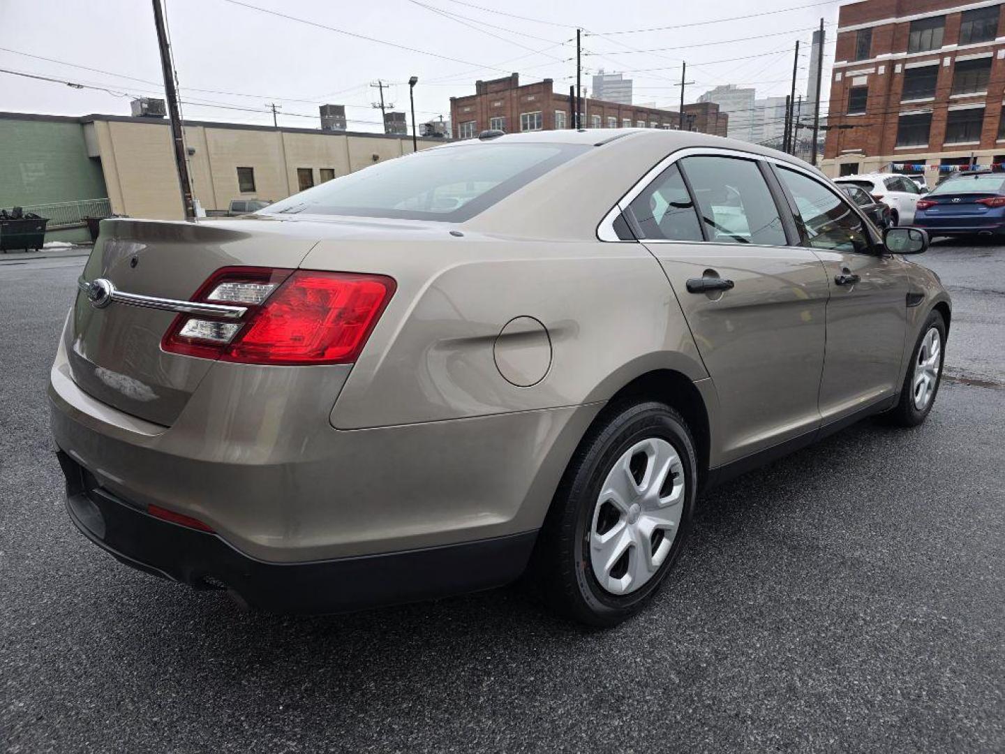 2013 GOLD FORD TAURUS POLICE INTERCEPTOR (1FAHP2M87DG) with an 3.5L engine, Automatic transmission, located at 117 North Cameron Street, Harrisburg, PA, 17101, (717) 963-8962, 40.266762, -76.875259 - WE FINANCE!!! Good Credit/ Challenged Credit/ No Credit - ALL Trade-Ins Welcomed!!! APPLY ONLINE or CALL us TODAY ;) Please call us to discuss your cash and/or financing options. - Photo#4