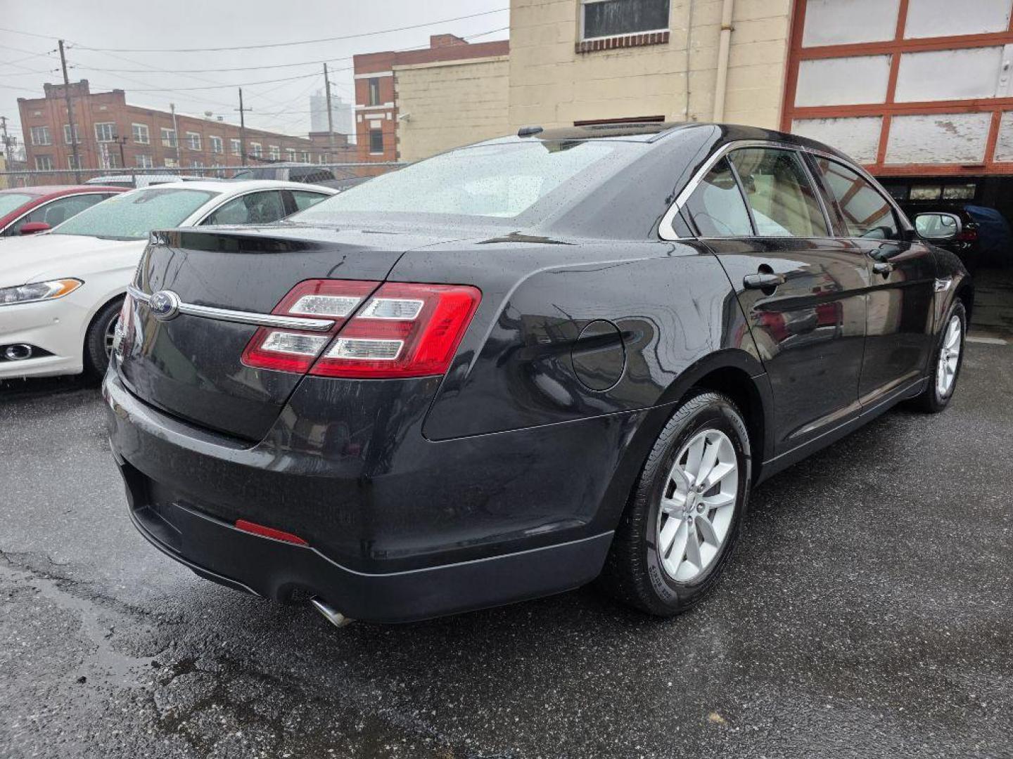 2013 BLACK FORD TAURUS SE (1FAHP2D87DG) with an 3.5L engine, Automatic transmission, located at 117 North Cameron Street, Harrisburg, PA, 17101, (717) 963-8962, 40.266762, -76.875259 - WE FINANCE!!! Good Credit/ Challenged Credit/ No Credit - ALL Trade-Ins Welcomed!!! APPLY ONLINE or CALL us TODAY ;) Please call us to discuss your cash and/or financing options. - Photo#4