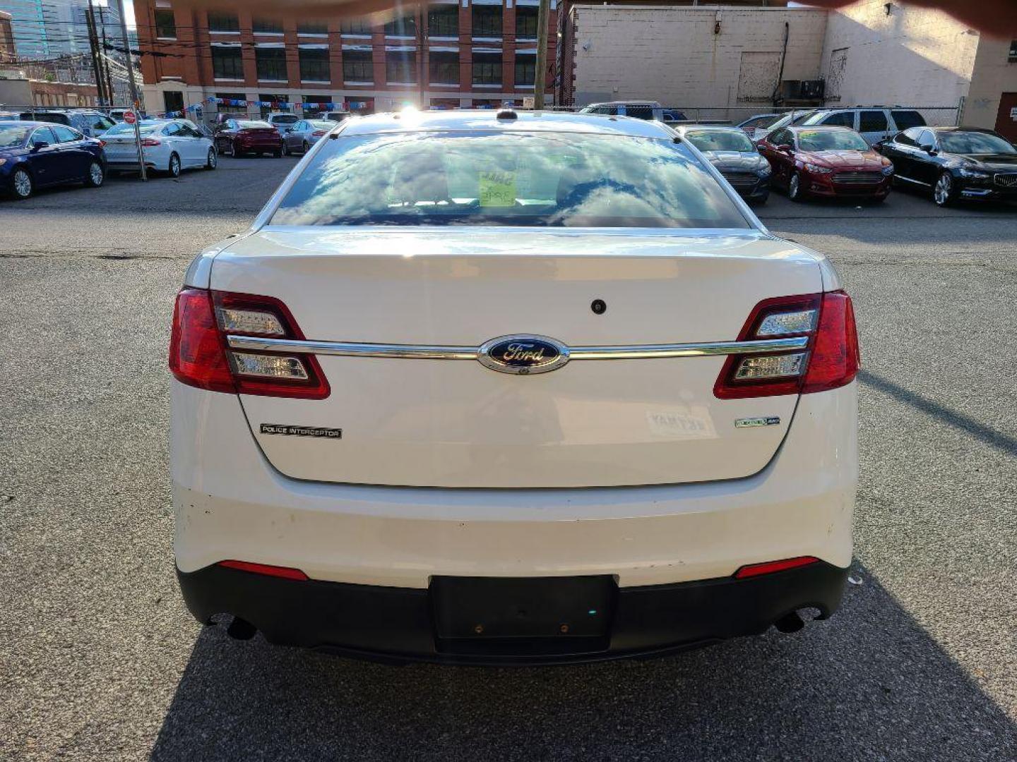 2014 WHITE FORD TAURUS POLICE INTERCEPTOR (1FAHP2MK5EG) with an 3.7L engine, Automatic transmission, located at 117 North Cameron Street, Harrisburg, PA, 17101, (717) 963-8962, 40.266762, -76.875259 - WE FINANCE!!! Good Credit/ Bad Credit/ No Credit - ALL Trade-Ins Welcomed!!! ***Guaranteed Credit Approval*** APPLY ONLINE or CALL us TODAY ;) Please call us to discuss your cash and financing options. - Photo#3