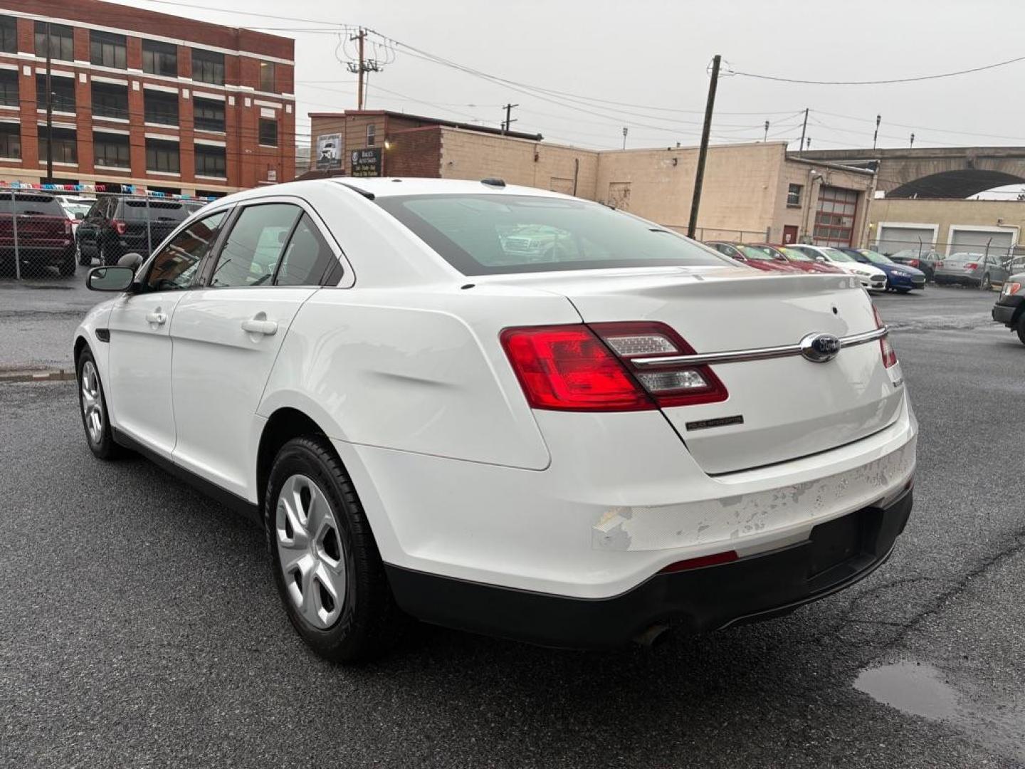 2014 WHITE FORD TAURUS POLICE INTERCEPTOR (1FAHP2MK7EG) with an 3.7L engine, Automatic transmission, located at 117 North Cameron Street, Harrisburg, PA, 17101, (717) 963-8962, 40.266762, -76.875259 - WE FINANCE!!! Good Credit/ Challenged Credit/ No Credit - ALL Trade-Ins Welcomed!!! APPLY ONLINE or CALL us TODAY ;) Please call us to discuss your cash and/or financing options. - Photo#2