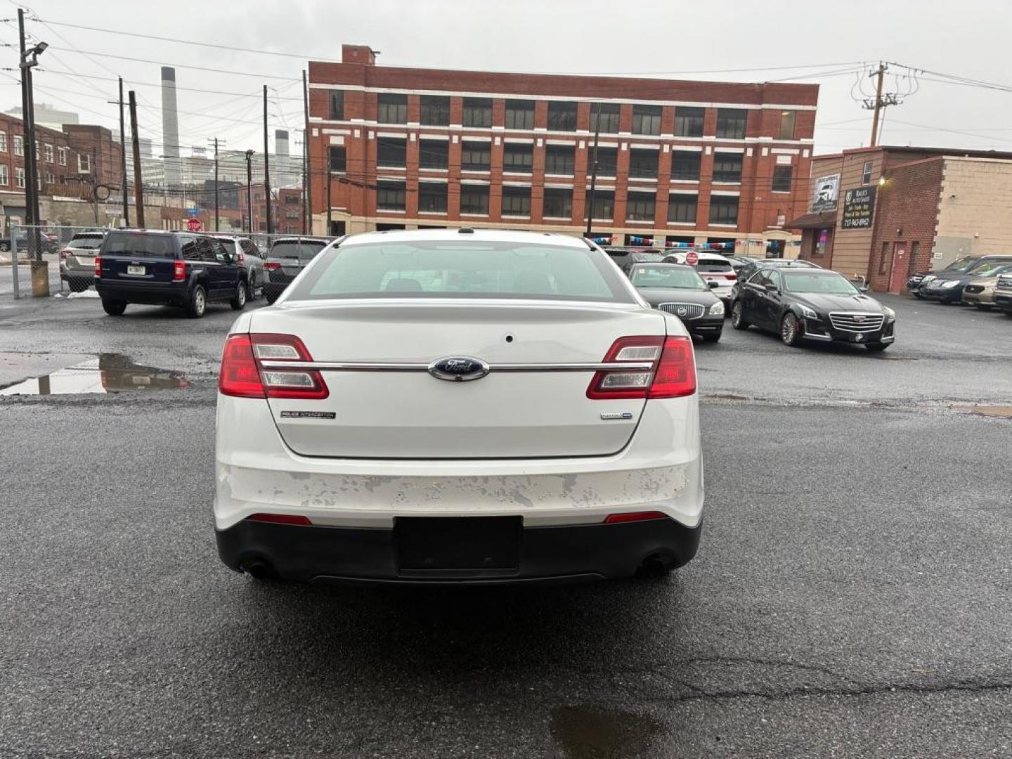 2014 WHITE FORD TAURUS POLICE INTERCEPTOR (1FAHP2MK7EG) with an 3.7L engine, Automatic transmission, located at 117 North Cameron Street, Harrisburg, PA, 17101, (717) 963-8962, 40.266762, -76.875259 - WE FINANCE!!! Good Credit/ Challenged Credit/ No Credit - ALL Trade-Ins Welcomed!!! APPLY ONLINE or CALL us TODAY ;) Please call us to discuss your cash and/or financing options. - Photo#3