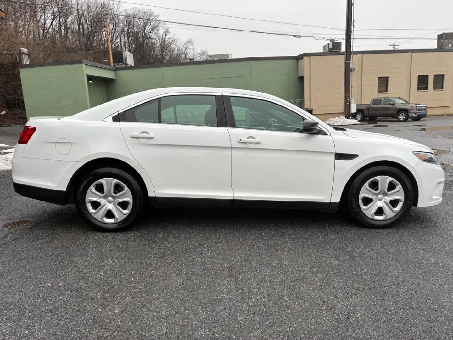 2014 WHITE FORD TAURUS POLICE INTERCEPTOR (1FAHP2MK7EG) with an 3.7L engine, Automatic transmission, located at 117 North Cameron Street, Harrisburg, PA, 17101, (717) 963-8962, 40.266762, -76.875259 - WE FINANCE!!! Good Credit/ Challenged Credit/ No Credit - ALL Trade-Ins Welcomed!!! APPLY ONLINE or CALL us TODAY ;) Please call us to discuss your cash and/or financing options. - Photo#5