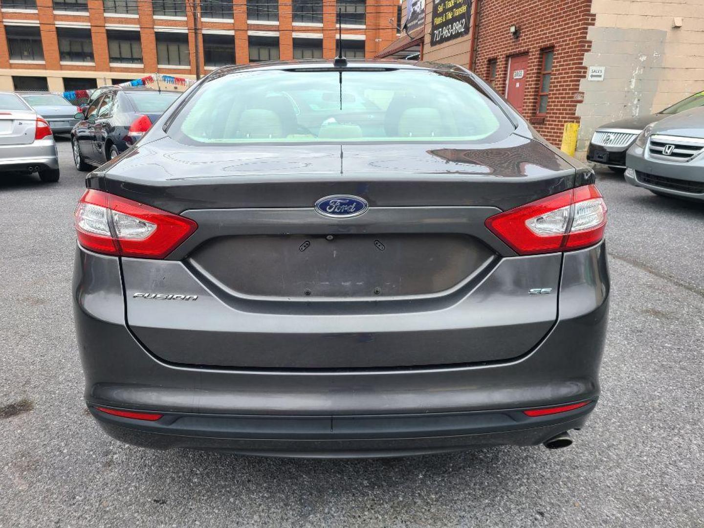 2015 GRAY FORD FUSION SE (1FA6P0H76F5) with an 2.5L engine, Automatic transmission, located at 117 North Cameron Street, Harrisburg, PA, 17101, (717) 963-8962, 40.266762, -76.875259 - WE FINANCE!!! Good Credit/ Bad Credit/ No Credit - ALL Trade-Ins Welcomed!!! ***Guaranteed Credit Approval*** APPLY ONLINE or CALL us TODAY ;) Internet Prices and Marketplace Prices are SPECIAL discounted ***CASH DEALS*** Retail Prices are higher. Please call us to discuss your cash and finan - Photo#3