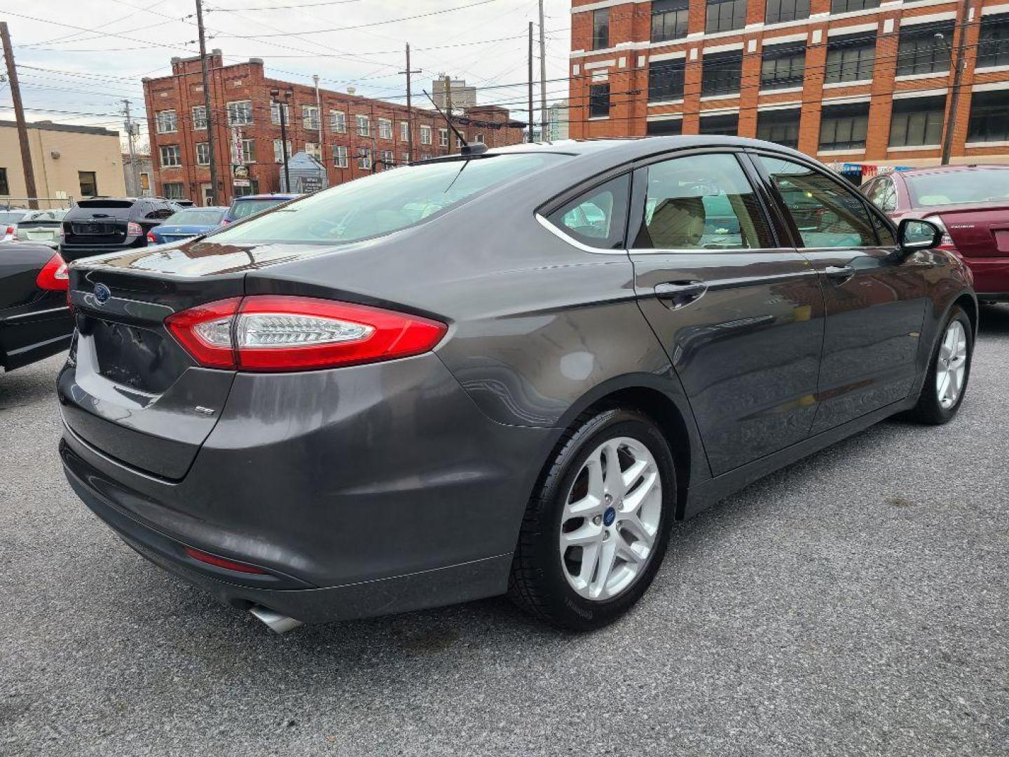 2015 GRAY FORD FUSION SE (1FA6P0H76F5) with an 2.5L engine, Automatic transmission, located at 117 North Cameron Street, Harrisburg, PA, 17101, (717) 963-8962, 40.266762, -76.875259 - WE FINANCE!!! Good Credit/ Bad Credit/ No Credit - ALL Trade-Ins Welcomed!!! ***Guaranteed Credit Approval*** APPLY ONLINE or CALL us TODAY ;) Internet Prices and Marketplace Prices are SPECIAL discounted ***CASH DEALS*** Retail Prices are higher. Please call us to discuss your cash and finan - Photo#4
