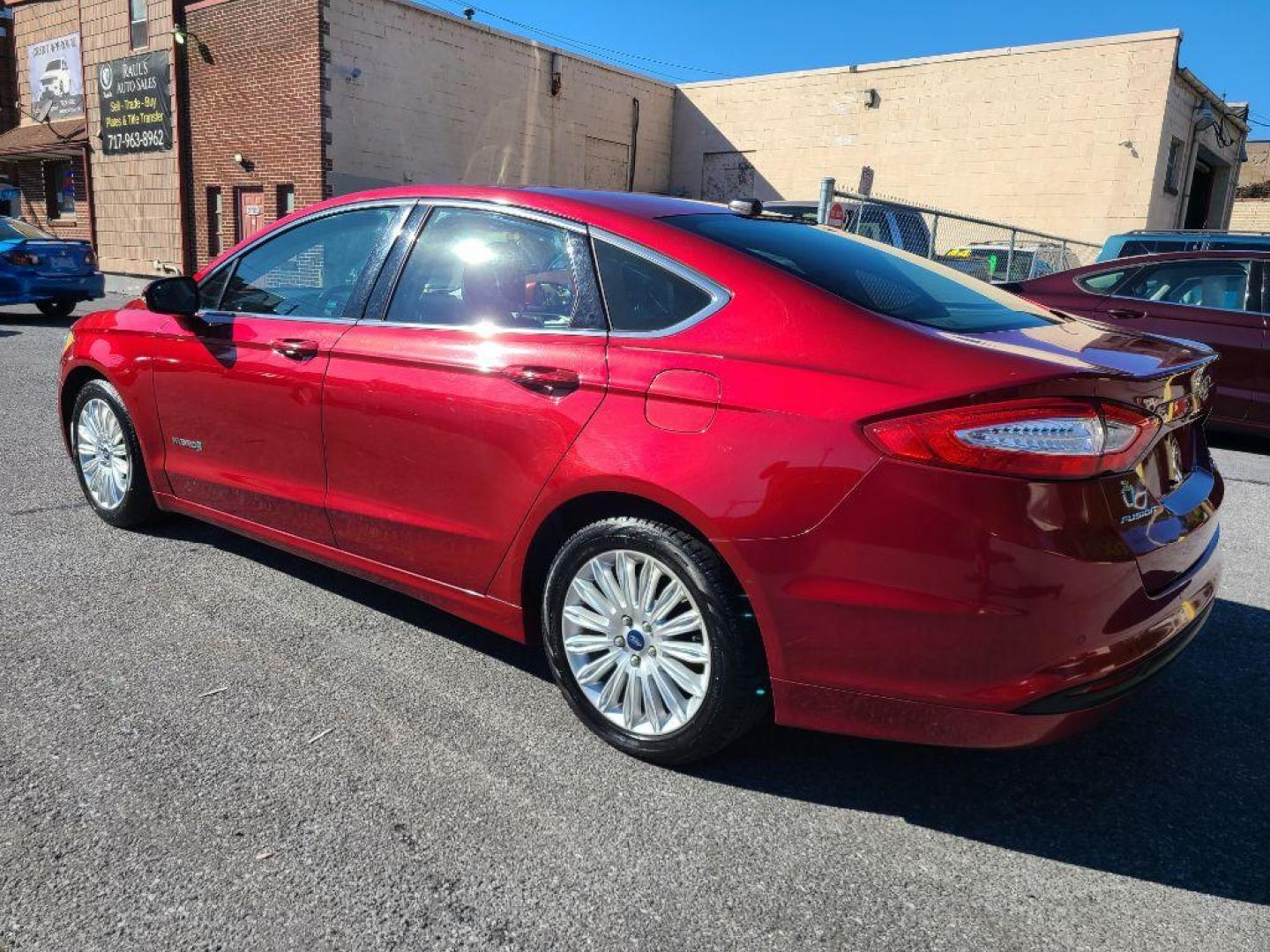 2015 RED FORD FUSION SE HYBRID (3FA6P0LU9FR) with an 2.0L engine, Continuously Variable transmission, located at 117 North Cameron Street, Harrisburg, PA, 17101, (717) 963-8962, 40.266762, -76.875259 - WE FINANCE!!! Good Credit/ Bad Credit/ No Credit - ALL Trade-Ins Welcomed!!! ***Guaranteed Credit Approval*** APPLY ONLINE or CALL us TODAY ;) Please call us to discuss your cash and financing options. - Photo#2