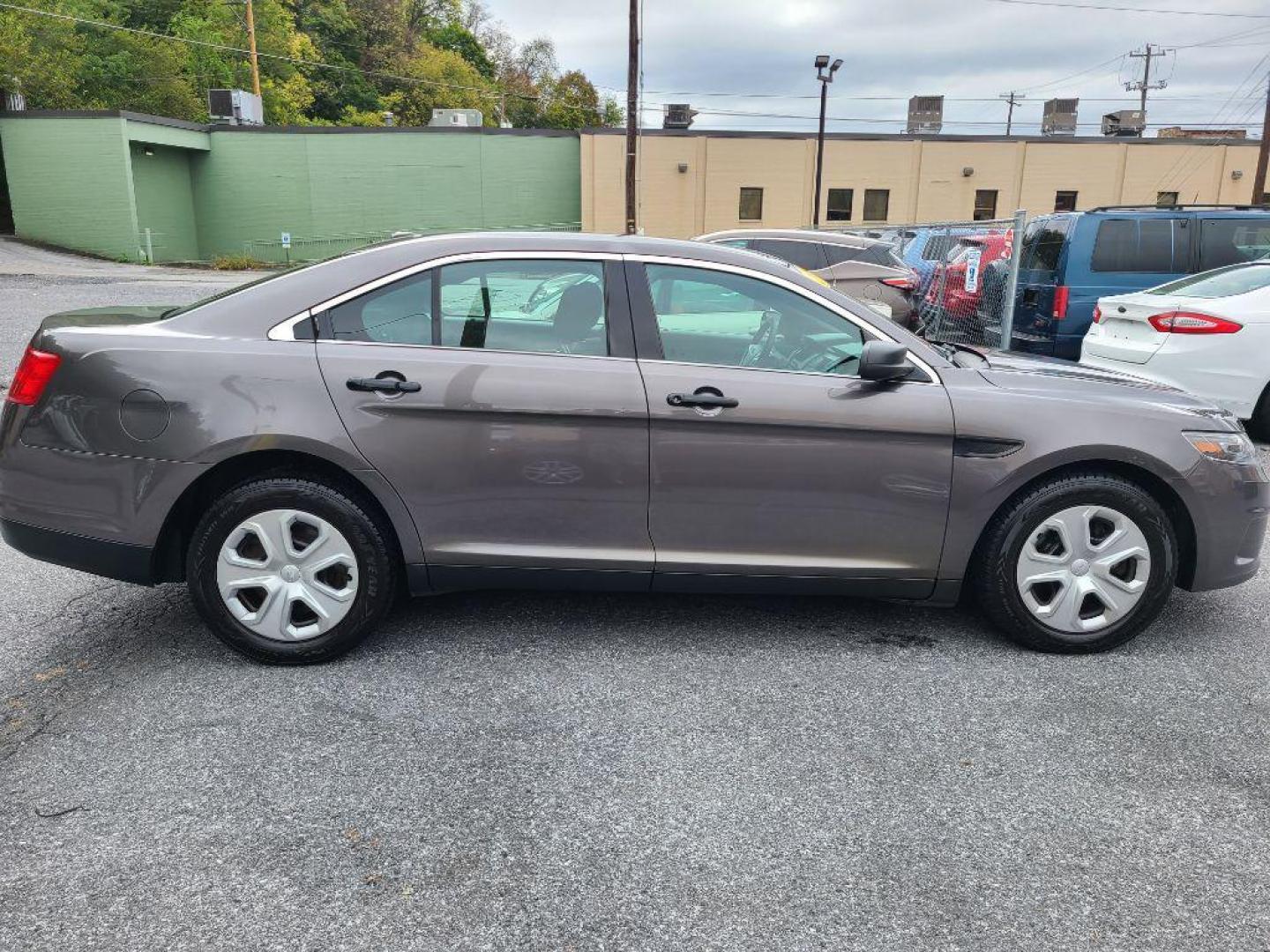 2015 GRAY FORD TAURUS POLICE INTERCEPTOR (1FAHP2MK4FG) with an 3.7L engine, Automatic transmission, located at 117 North Cameron Street, Harrisburg, PA, 17101, (717) 963-8962, 40.266762, -76.875259 - WE FINANCE!!! Good Credit/ Bad Credit/ No Credit - ALL Trade-Ins Welcomed!!! ***Guaranteed Credit Approval*** APPLY ONLINE or CALL us TODAY ;) Please call us to discuss your cash and financing options. - Photo#1