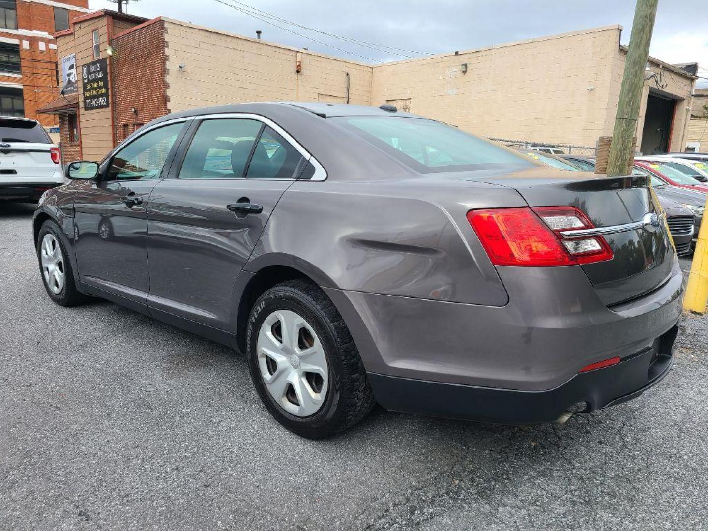 2015 GRAY FORD TAURUS POLICE INTERCEPTOR (1FAHP2MK4FG) with an 3.7L engine, Automatic transmission, located at 117 North Cameron Street, Harrisburg, PA, 17101, (717) 963-8962, 40.266762, -76.875259 - WE FINANCE!!! Good Credit/ Bad Credit/ No Credit - ALL Trade-Ins Welcomed!!! ***Guaranteed Credit Approval*** APPLY ONLINE or CALL us TODAY ;) Please call us to discuss your cash and financing options. - Photo#3