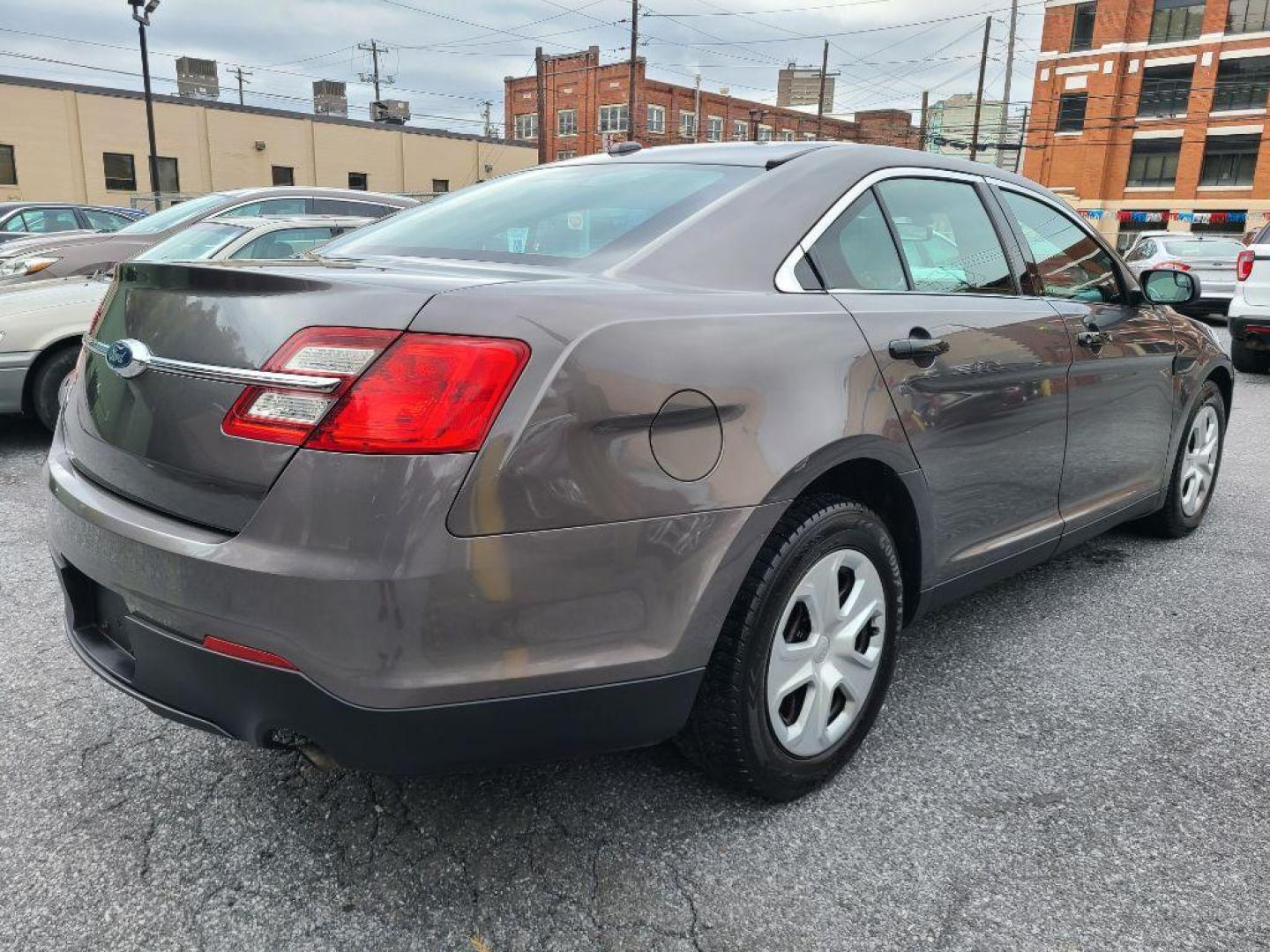 2015 GRAY FORD TAURUS POLICE INTERCEPTOR (1FAHP2MK4FG) with an 3.7L engine, Automatic transmission, located at 117 North Cameron Street, Harrisburg, PA, 17101, (717) 963-8962, 40.266762, -76.875259 - WE FINANCE!!! Good Credit/ Bad Credit/ No Credit - ALL Trade-Ins Welcomed!!! ***Guaranteed Credit Approval*** APPLY ONLINE or CALL us TODAY ;) Please call us to discuss your cash and financing options. - Photo#5