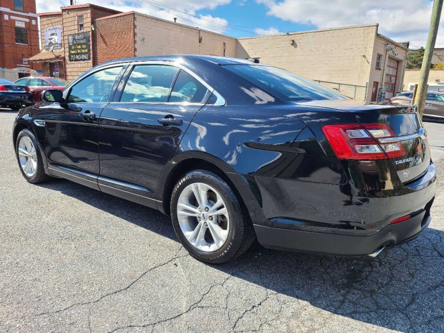2016 BLACK FORD TAURUS SEL (1FAHP2E85GG) with an 3.5L engine, Automatic transmission, located at 117 North Cameron Street, Harrisburg, PA, 17101, (717) 963-8962, 40.266762, -76.875259 - WE FINANCE!!! Good Credit/ Bad Credit/ No Credit - ALL Trade-Ins Welcomed!!! ***Guaranteed Credit Approval*** APPLY ONLINE or CALL us TODAY ;) Internet Prices and Marketplace Prices are SPECIAL discounted ***CASH DEALS*** Retail Prices are higher. Please call us to discuss your cash and finan - Photo#4