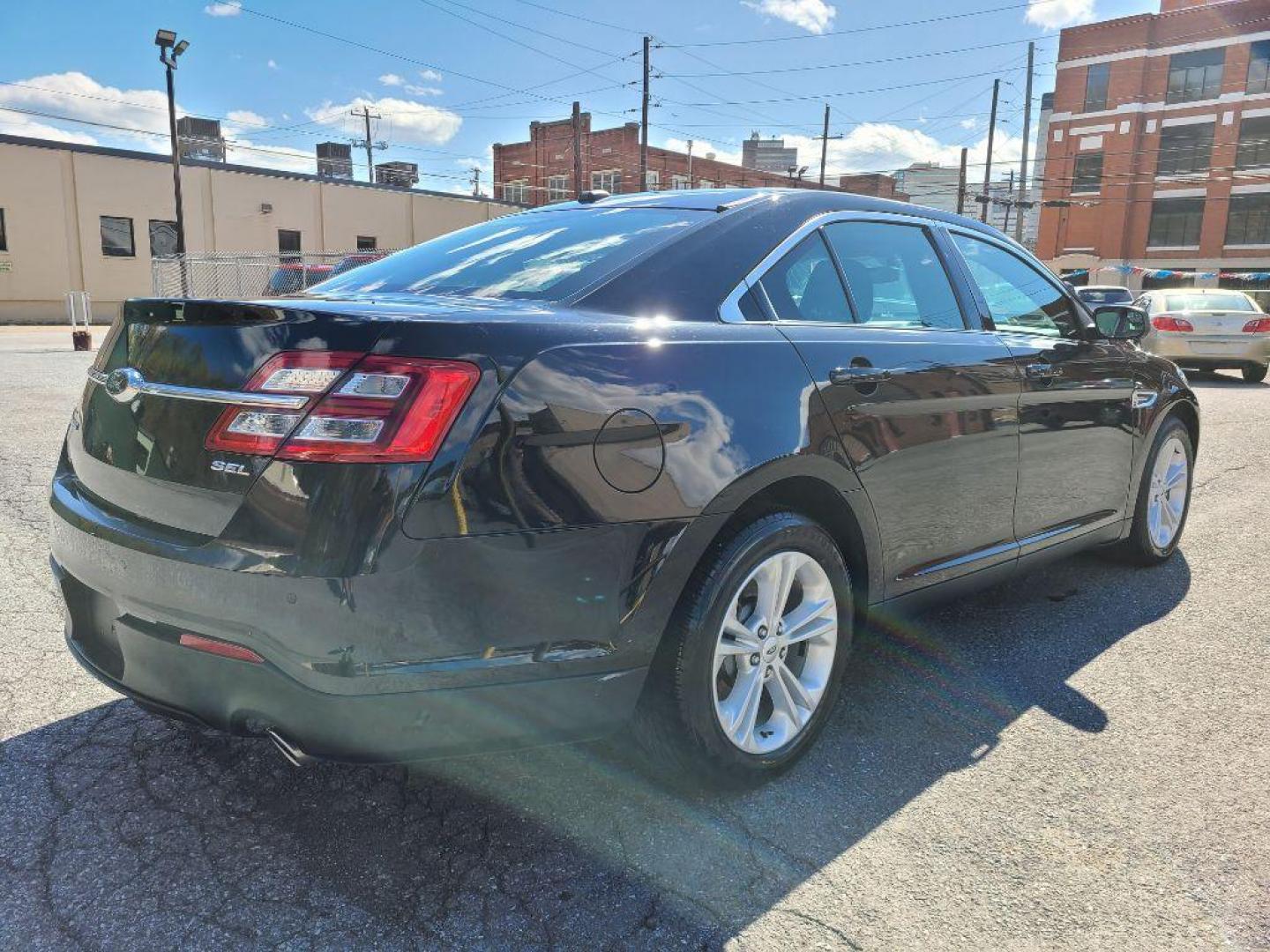 2016 BLACK FORD TAURUS SEL (1FAHP2E85GG) with an 3.5L engine, Automatic transmission, located at 117 North Cameron Street, Harrisburg, PA, 17101, (717) 963-8962, 40.266762, -76.875259 - WE FINANCE!!! Good Credit/ Bad Credit/ No Credit - ALL Trade-Ins Welcomed!!! ***Guaranteed Credit Approval*** APPLY ONLINE or CALL us TODAY ;) Internet Prices and Marketplace Prices are SPECIAL discounted ***CASH DEALS*** Retail Prices are higher. Please call us to discuss your cash and finan - Photo#5