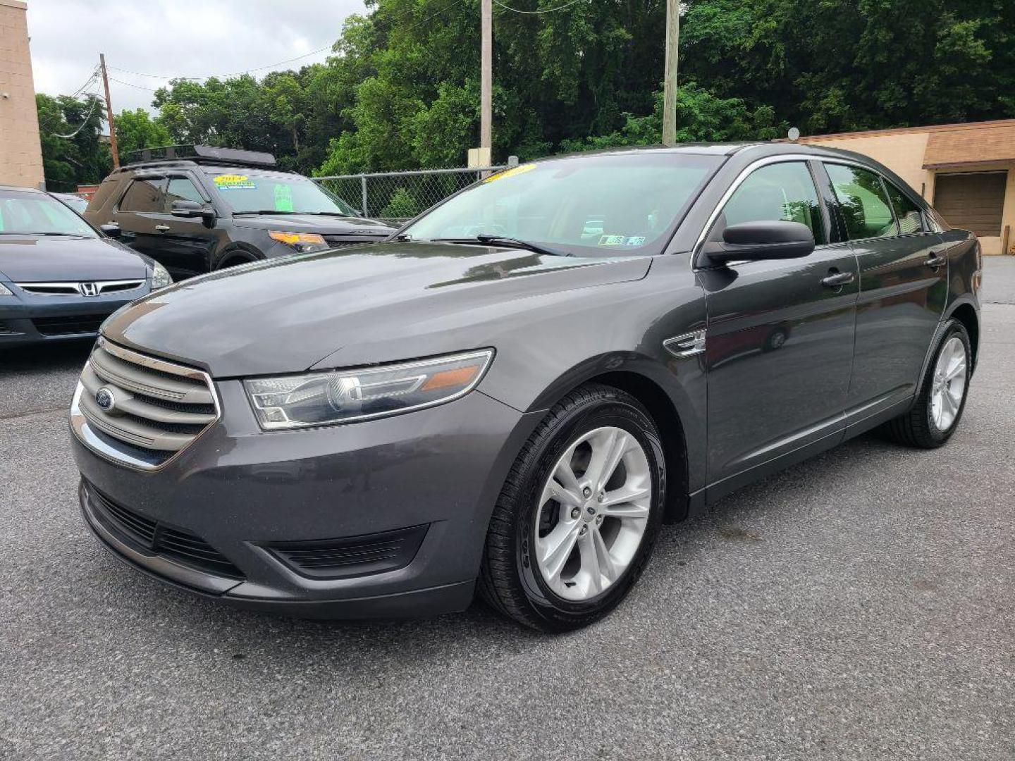 2016 GRAY FORD TAURUS SE (1FAHP2D80GG) with an 3.5L engine, Automatic transmission, located at 117 North Cameron Street, Harrisburg, PA, 17101, (717) 963-8962, 40.266762, -76.875259 - WE FINANCE!!! Good Credit/ Bad Credit/ No Credit - ALL Trade-Ins Welcomed!!! ***Guaranteed Credit Approval*** APPLY ONLINE or CALL us TODAY ;) Internet Prices and Marketplace Prices are SPECIAL discounted ***CASH DEALS*** Retail Prices are higher. Please call us to discuss your cash and finan - Photo#0