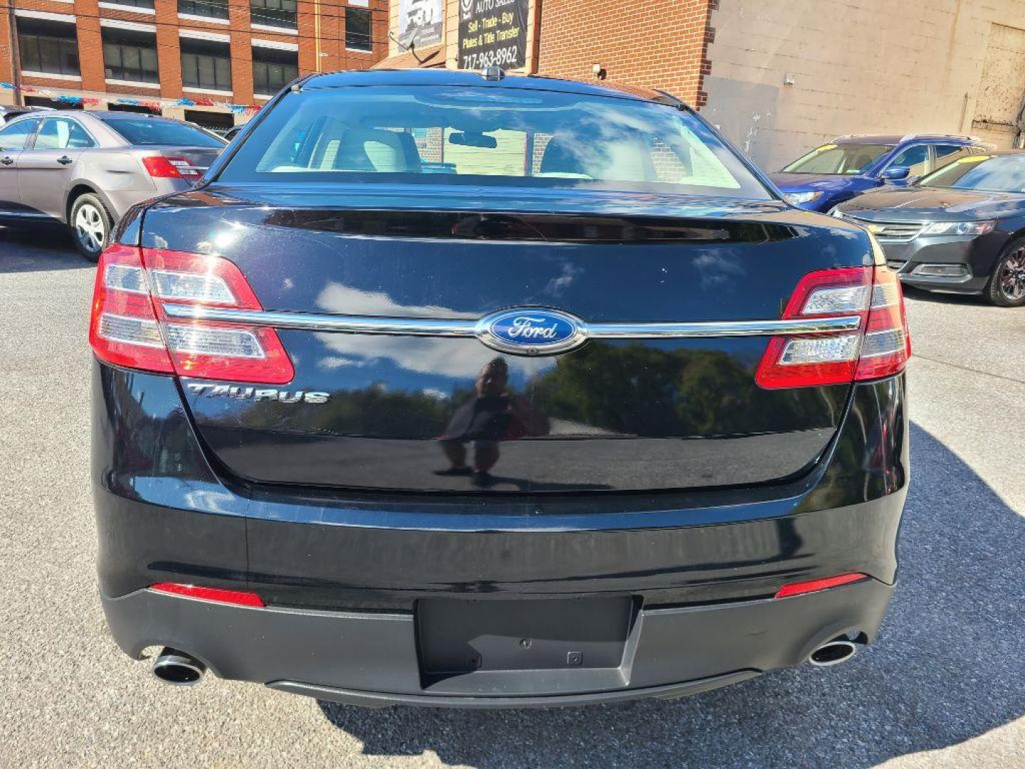 2016 BLACK FORD TAURUS SE (1FAHP2D8XGG) with an 3.5L engine, Automatic transmission, located at 117 North Cameron Street, Harrisburg, PA, 17101, (717) 963-8962, 40.266762, -76.875259 - WE FINANCE!!! Good Credit/ Bad Credit/ No Credit - ALL Trade-Ins Welcomed!!! ***Guaranteed Credit Approval*** APPLY ONLINE or CALL us TODAY ;) Please call us to discuss your cash and financing options. - Photo#3