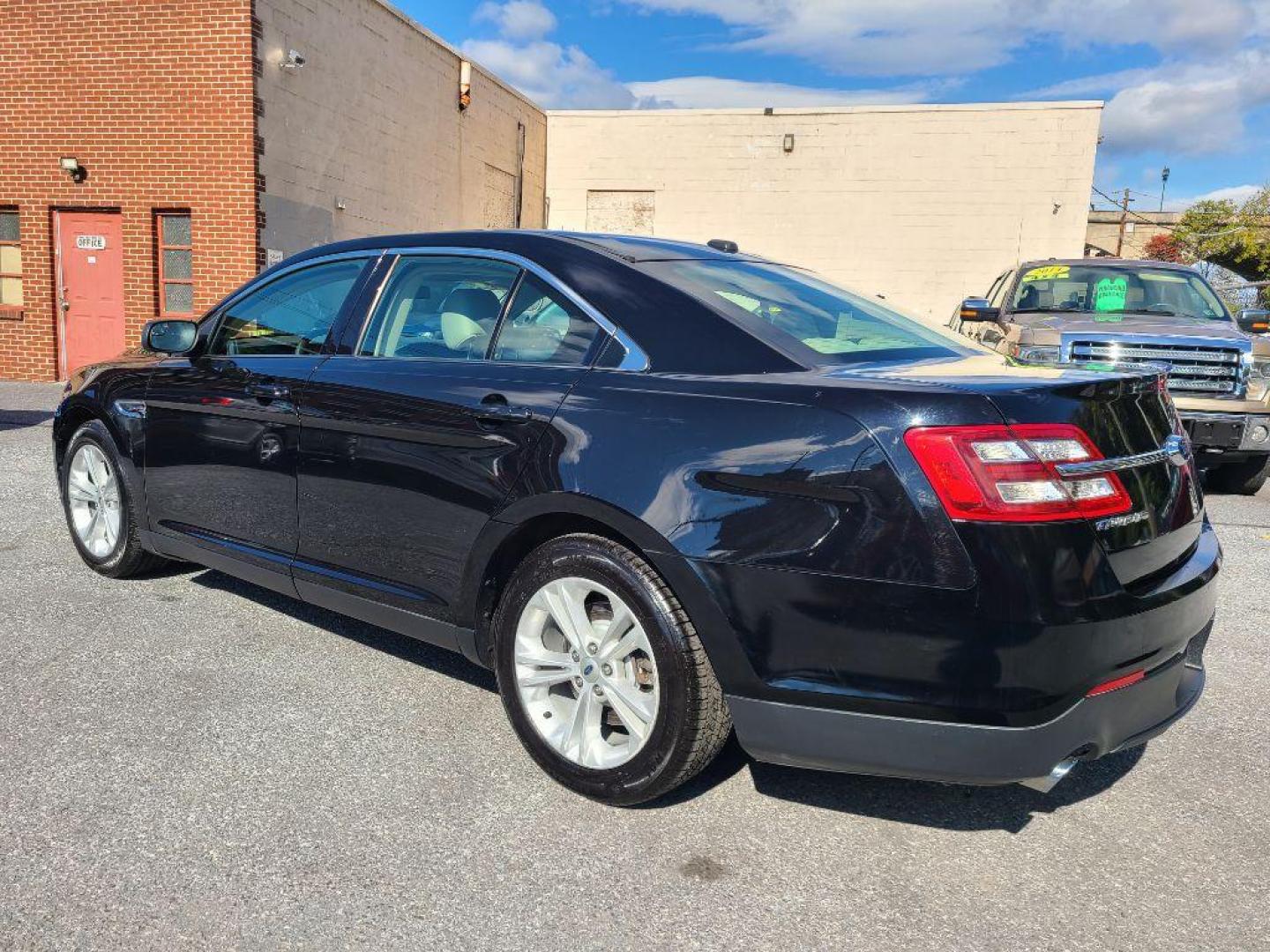 2016 BLACK FORD TAURUS SE (1FAHP2D8XGG) with an 3.5L engine, Automatic transmission, located at 117 North Cameron Street, Harrisburg, PA, 17101, (717) 963-8962, 40.266762, -76.875259 - WE FINANCE!!! Good Credit/ Bad Credit/ No Credit - ALL Trade-Ins Welcomed!!! ***Guaranteed Credit Approval*** APPLY ONLINE or CALL us TODAY ;) Please call us to discuss your cash and financing options. - Photo#2