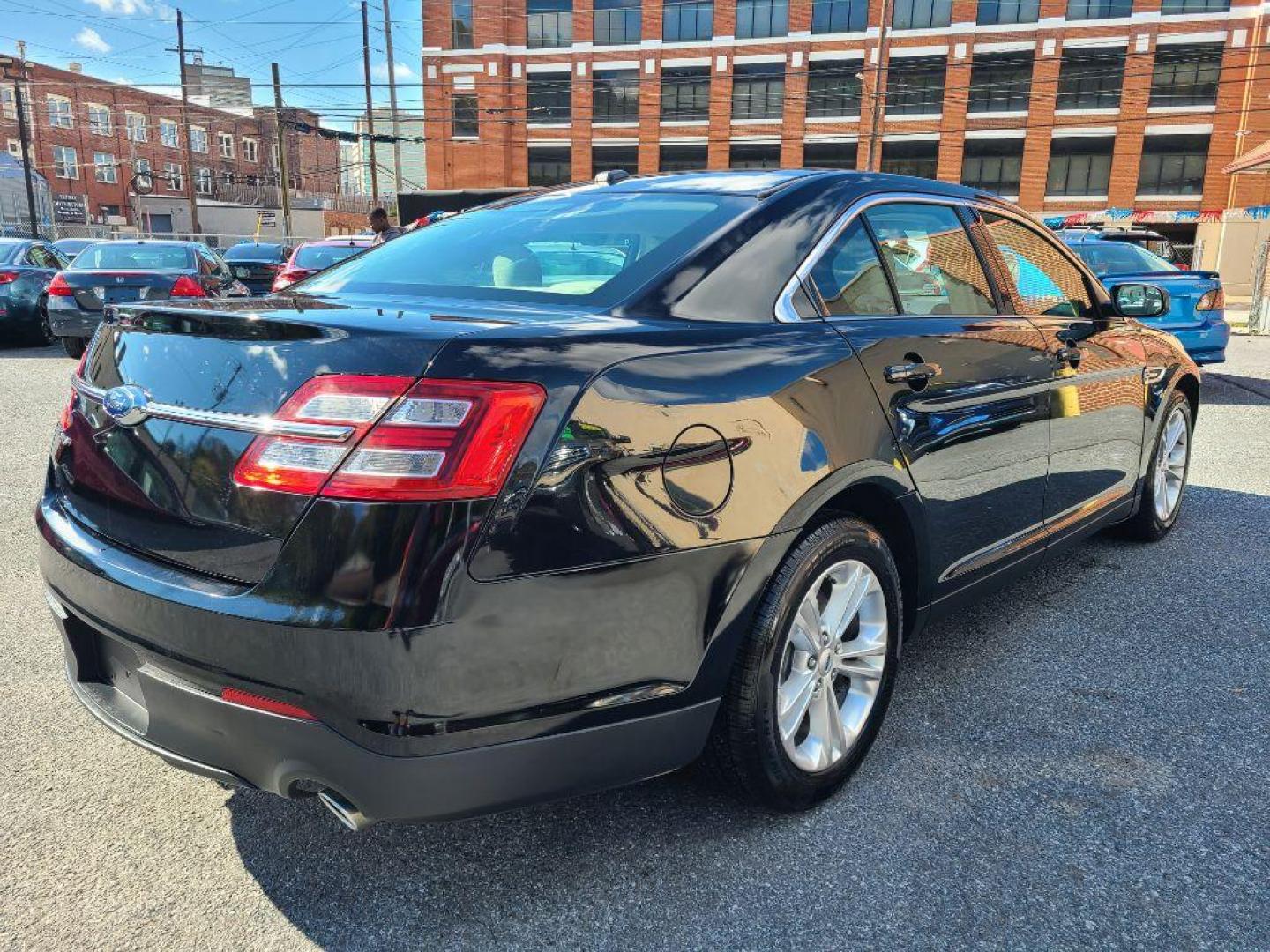 2016 BLACK FORD TAURUS SE (1FAHP2D8XGG) with an 3.5L engine, Automatic transmission, located at 117 North Cameron Street, Harrisburg, PA, 17101, (717) 963-8962, 40.266762, -76.875259 - WE FINANCE!!! Good Credit/ Bad Credit/ No Credit - ALL Trade-Ins Welcomed!!! ***Guaranteed Credit Approval*** APPLY ONLINE or CALL us TODAY ;) Please call us to discuss your cash and financing options. - Photo#5