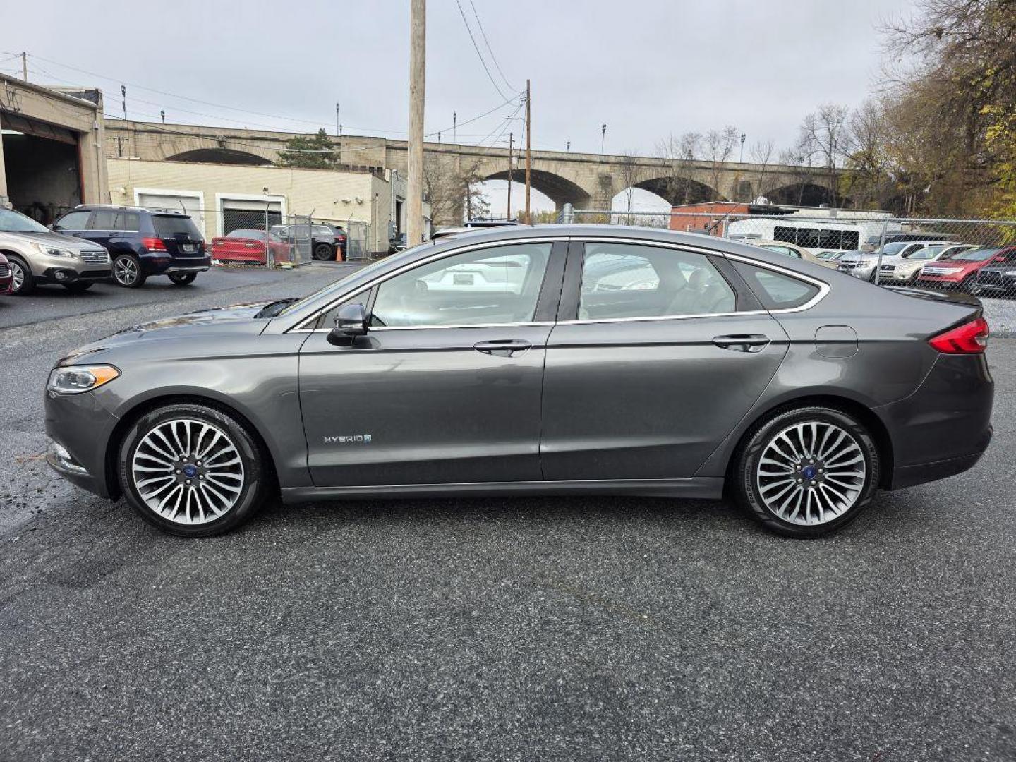 2017 GRAY FORD FUSION TITANIUM HEV (3FA6P0RU8HR) with an 2.0L engine, Continuously Variable transmission, located at 117 North Cameron Street, Harrisburg, PA, 17101, (717) 963-8962, 40.266762, -76.875259 - WE FINANCE!!! Good Credit/ Bad Credit/ No Credit - ALL Trade-Ins Welcomed!!! ***Guaranteed Credit Approval*** APPLY ONLINE or CALL us TODAY ;) Please call us to discuss your cash and financing options. - Photo#1